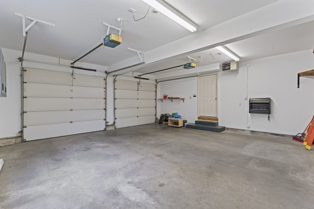 925 Magnolia Dr, Bourbonnais, IL 60914 - garage featuring a garage door opener