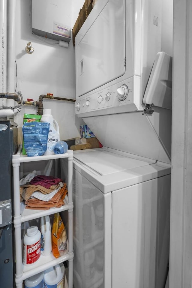 3316 W Byron St Unit 1, Chicago, IL 60618 - laundry area with estacked washer and dryer and water heater