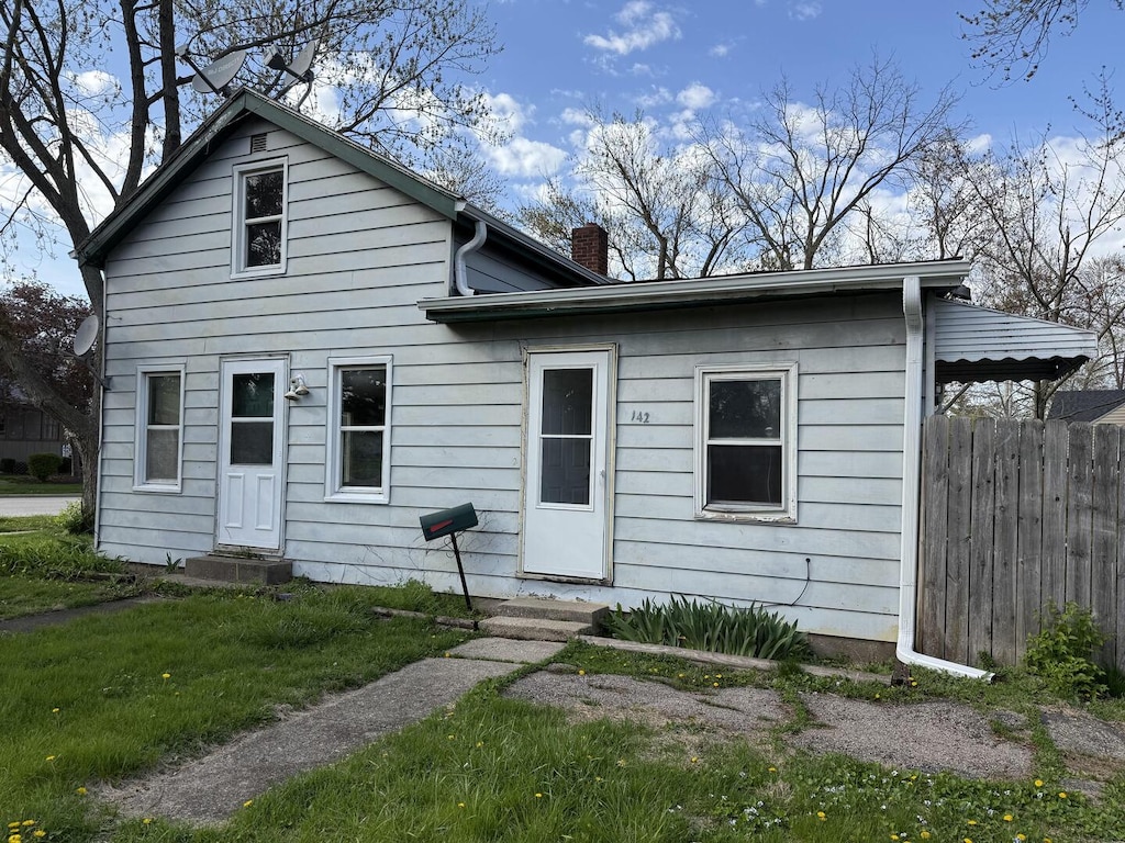 142 Jefferson St, Montgomery, IL 60538 - view of front of house with entry steps and a chimney