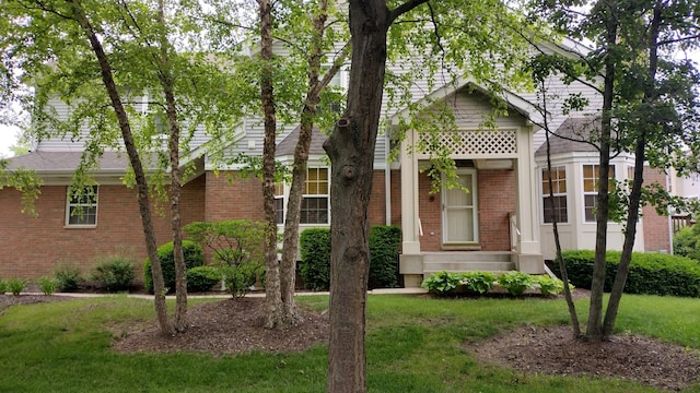 1317 Leonard Dr, Schaumburg, IL 60193 - view of front of house with brick siding and a front lawn