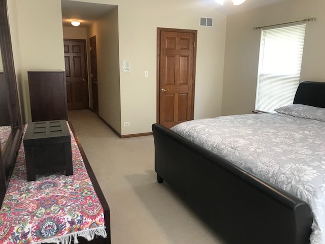 1317 Leonard Dr, Schaumburg, IL 60193 - bedroom featuring light carpet and baseboards