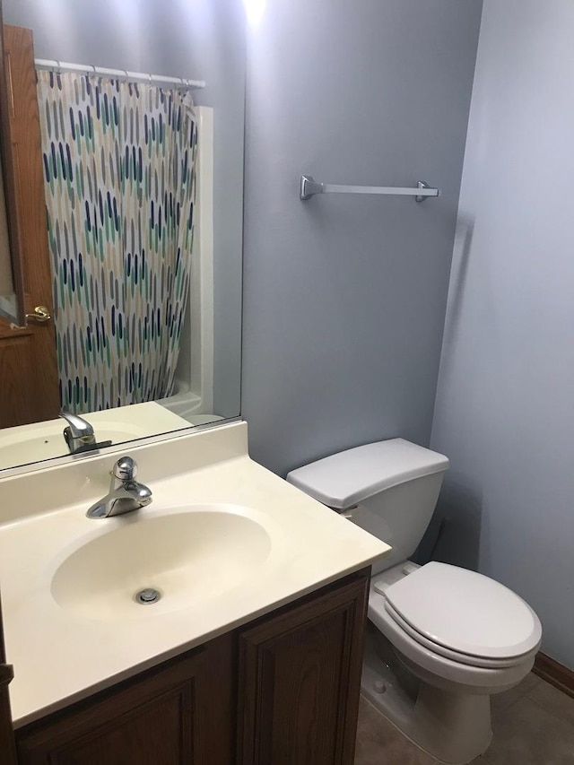 1317 Leonard Dr, Schaumburg, IL 60193 - full bathroom featuring a shower with shower curtain, vanity, and tile patterned floors