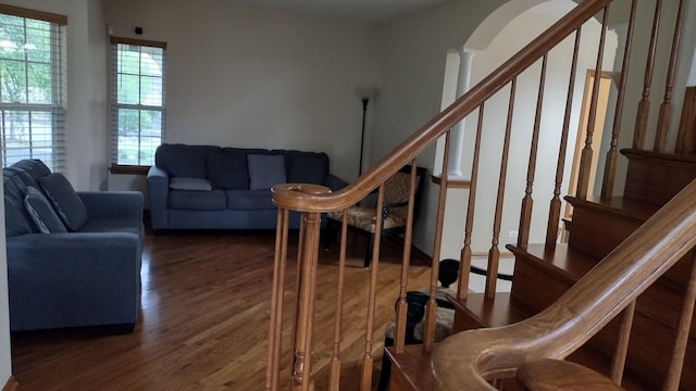 1317 Leonard Dr, Schaumburg, IL 60193 - stairs with arched walkways, wood finished floors, and decorative columns