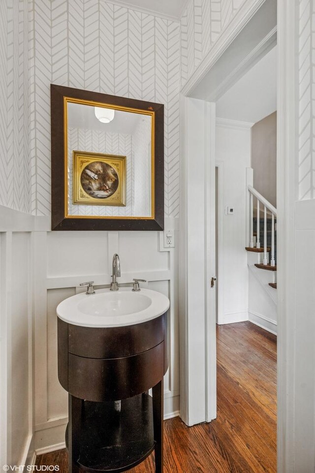 3233 Park Pl, Evanston, IL 60201 - bathroom with wallpapered walls, wood finished floors, and crown molding