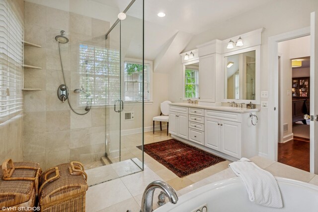 3233 Park Pl, Evanston, IL 60201 - bathroom with a shower stall, double vanity, vaulted ceiling, a bath, and recessed lighting