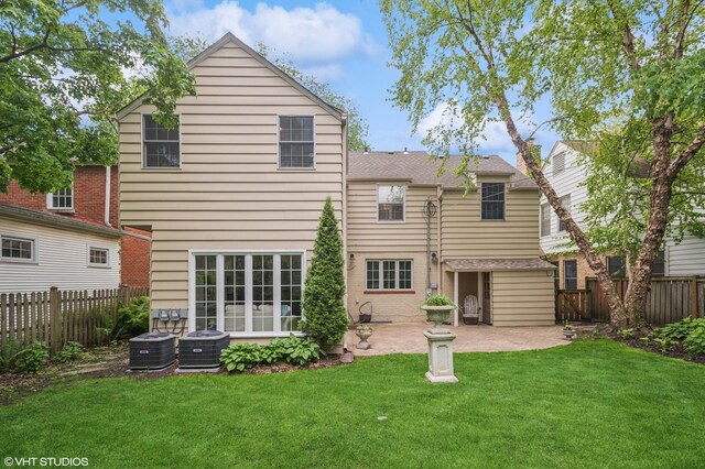 3233 Park Pl, Evanston, IL 60201 - rear view of property featuring a patio area and a fenced backyard
