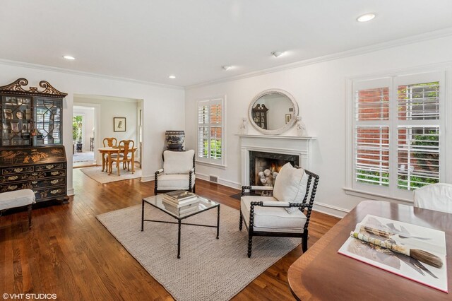 3233 Park Pl, Evanston, IL 60201 - living area featuring crown molding, wood finished floors, a premium fireplace, and recessed lighting