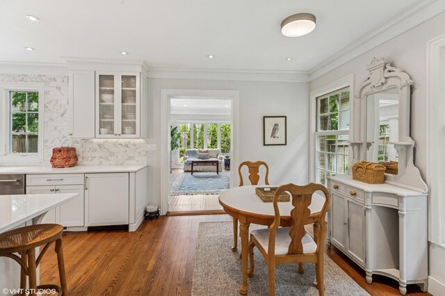 3233 Park Pl, Evanston, IL 60201 - dining space featuring healthy amount of natural light, wood finished floors, and ornamental molding