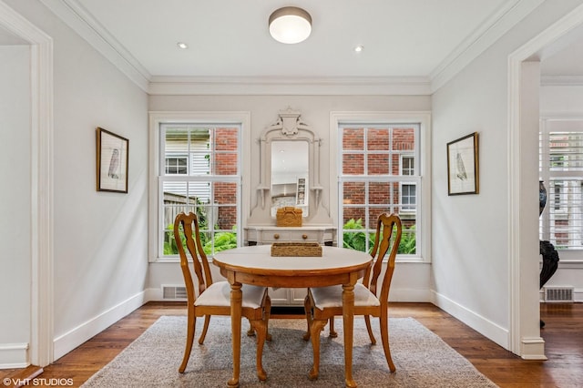 3233 Park Pl, Evanston, IL 60201 - dining space with crown molding, healthy amount of natural light, and wood finished floors
