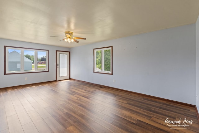 301 N Second St, Ashkum, IL 60911 - spare room featuring ceiling fan and dark wood-style flooring