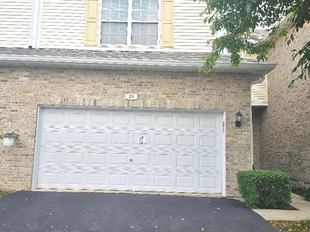 20 Lily Ct, Bolingbrook, IL 60440 - garage with asphalt driveway