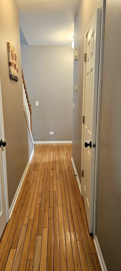 20 Lily Ct, Bolingbrook, IL 60440 - hallway with wood finished floors and stairs