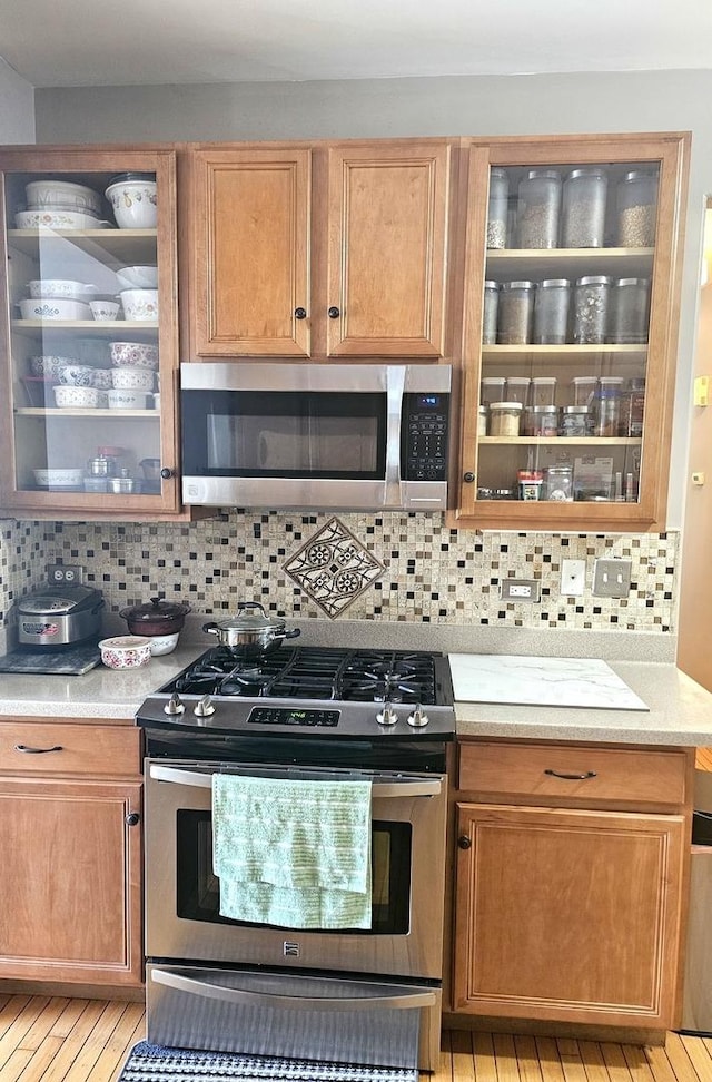 20 Lily Ct, Bolingbrook, IL 60440 - kitchen with stainless steel appliances, light countertops, and backsplash