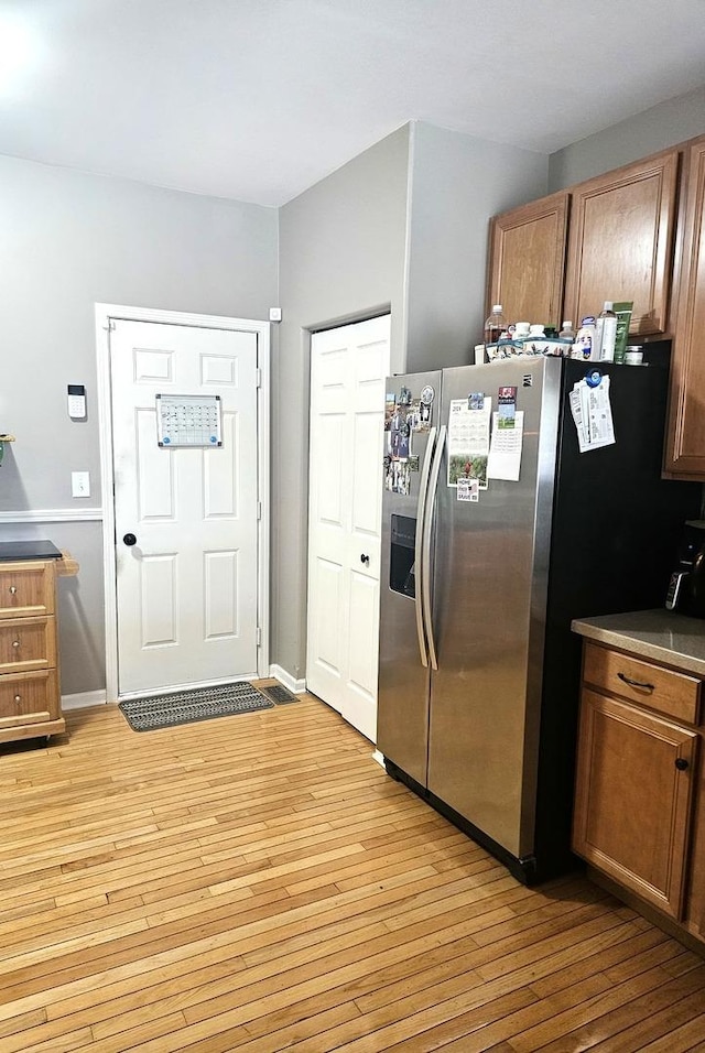 20 Lily Ct, Bolingbrook, IL 60440 - kitchen with stainless steel fridge, light wood-type flooring, and brown cabinetry