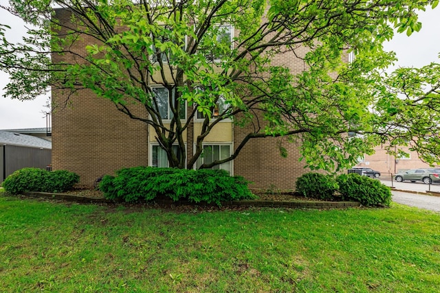 9516 S Kildare Ave Unit 2N, Oak Lawn, IL 60453 - view of side of home with a lawn and brick siding