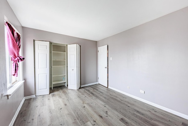 9516 S Kildare Ave Unit 2N, Oak Lawn, IL 60453 - unfurnished bedroom featuring light wood finished floors and a closet