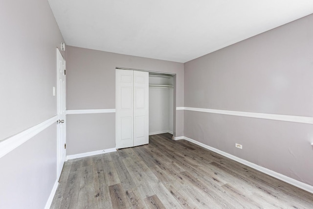 9516 S Kildare Ave Unit 2N, Oak Lawn, IL 60453 - unfurnished bedroom featuring wood finished floors and a closet
