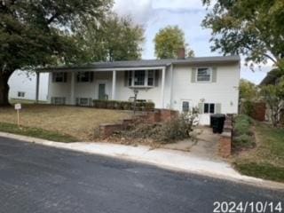 1406 Searle Dr, Normal, IL 61761 - bi-level home featuring covered porch