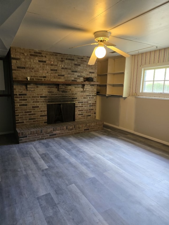 1406 Searle Dr, Normal, IL 61761 - unfurnished living room featuring wood finished floors, a ceiling fan, and a brick fireplace