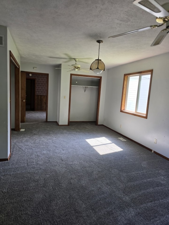 1406 Searle Dr, Normal, IL 61761 - carpeted empty room with a ceiling fan and a textured ceiling
