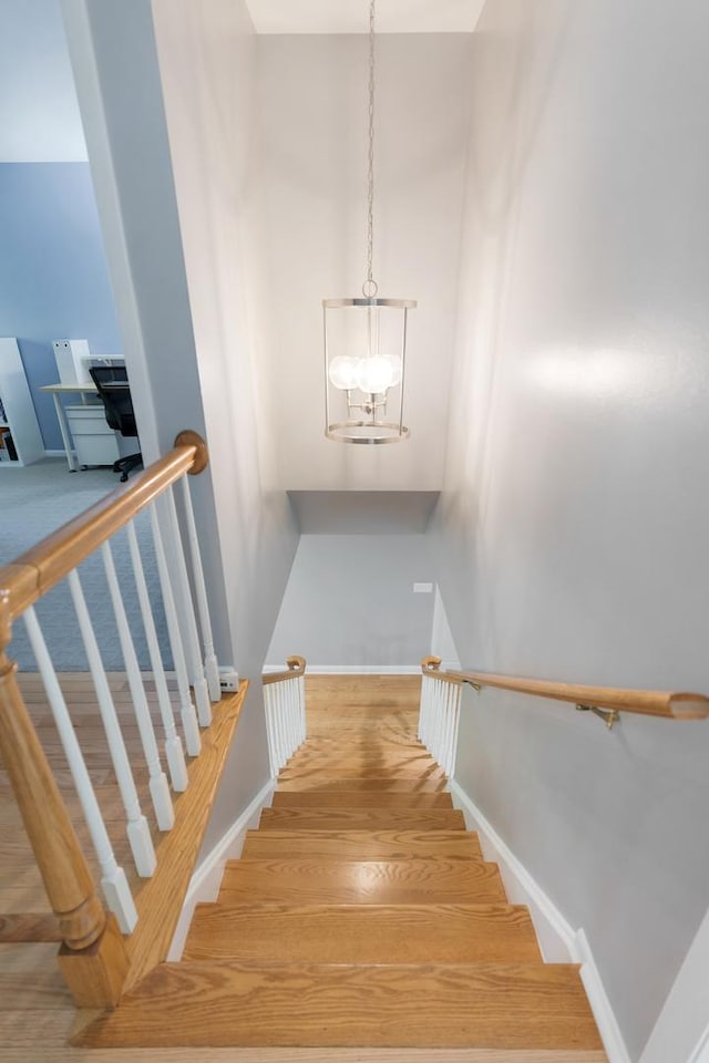 221 Pin Oak Dr, Wilmette, IL 60091 - stairs featuring wood finished floors and a chandelier