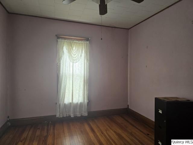 200 S Gillham, West Point, IL 62380 - unfurnished room with a ceiling fan and hardwood / wood-style floors
