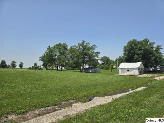 200 S Gillham, West Point, IL 62380 - view of green lawn featuring an outbuilding