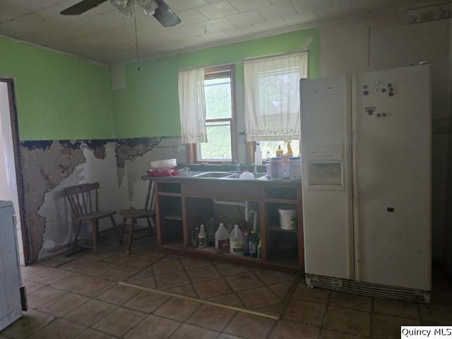 200 S Gillham, West Point, IL 62380 - kitchen with white fridge with ice dispenser and ceiling fan
