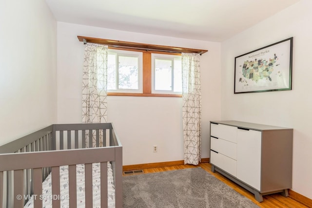 812 S Center St, Plano, IL 60545 - unfurnished bedroom featuring wood finished floors and baseboards