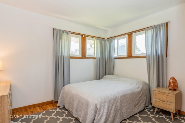 812 S Center St, Plano, IL 60545 - bedroom with wood finished floors and baseboards