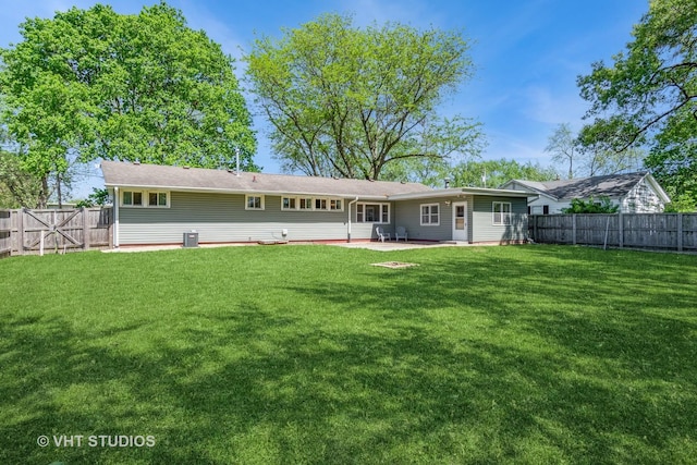 812 S Center St, Plano, IL 60545 - rear view of property featuring a patio and a fenced backyard