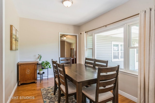 812 S Center St, Plano, IL 60545 - dining room featuring baseboards and light wood finished floors