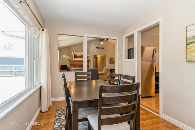 812 S Center St, Plano, IL 60545 - dining area featuring light wood-type flooring and baseboards