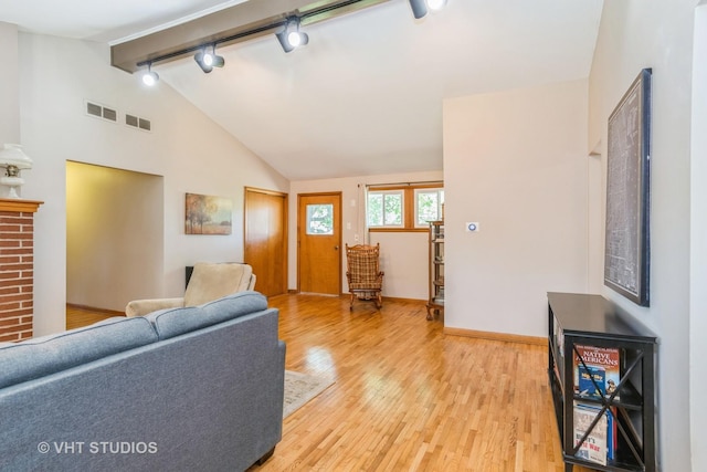 812 S Center St, Plano, IL 60545 - living room with light wood-type flooring and track lighting