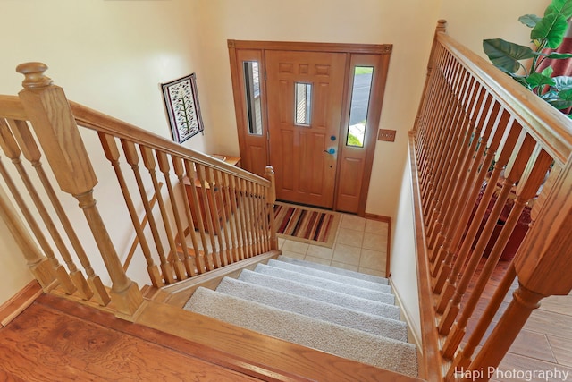 27892 W Bayview Dr, Ingleside, IL 60041 - tiled entryway featuring stairway and baseboards