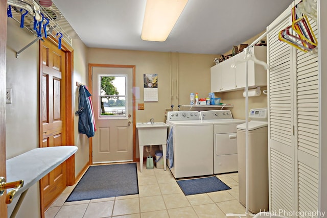 27892 W Bayview Dr, Ingleside, IL 60041 - laundry area with independent washer and dryer, cabinet space, and light tile patterned flooring