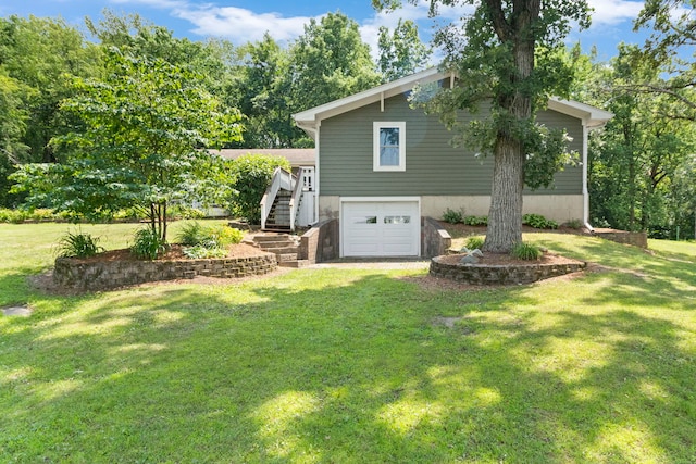 43 Coffman Ln, Plano, IL 60545 - view of property exterior with stairway, an attached garage, and a yard