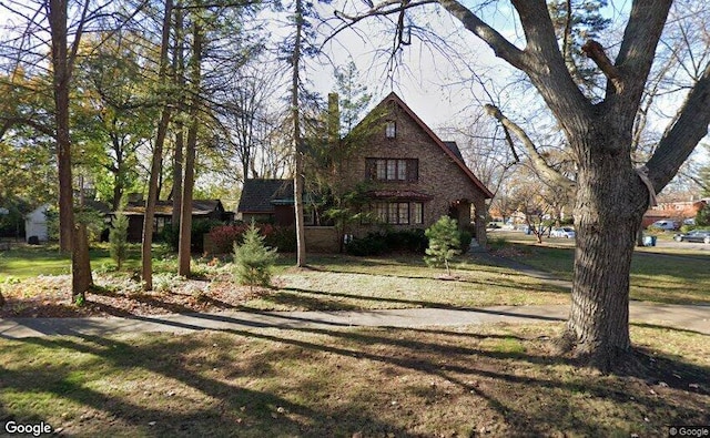 103 S Calumet Ave, Aurora, IL 60506 - tudor house with a front yard