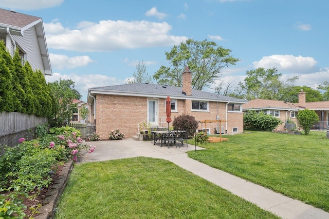 9333 Kildare Ave, Skokie, IL 60076 - back of house featuring brick siding, a patio, and a chimney