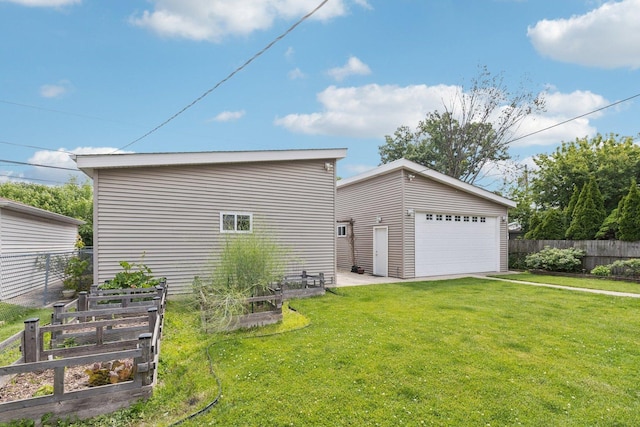 9333 Kildare Ave, Skokie, IL 60076 - view of home's exterior featuring a vegetable garden, a detached garage, and an outbuilding