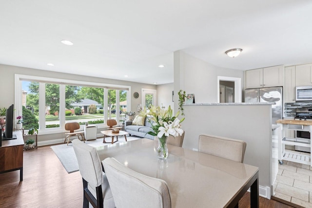 9333 Kildare Ave, Skokie, IL 60076 - dining room with dark wood finished floors and recessed lighting