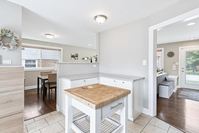9333 Kildare Ave, Skokie, IL 60076 - kitchen featuring white cabinets, light countertops, light tile patterned floors, and recessed lighting