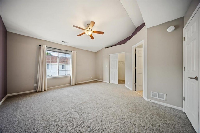180 New Haven Dr, Cary, IL 60013 - unfurnished bedroom with vaulted ceiling, carpet, and ceiling fan