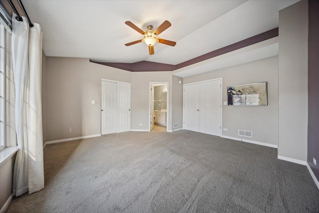 180 New Haven Dr, Cary, IL 60013 - unfurnished bedroom featuring carpet, connected bathroom, and ceiling fan