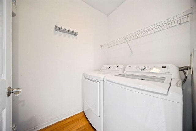 180 New Haven Dr, Cary, IL 60013 - laundry area featuring washing machine and clothes dryer and light wood finished floors