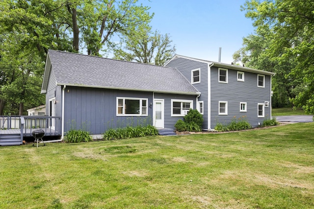 550 N Center St, South Elgin, IL 60177 - view of front of property with a front lawn, a wooden deck, and roof with shingles