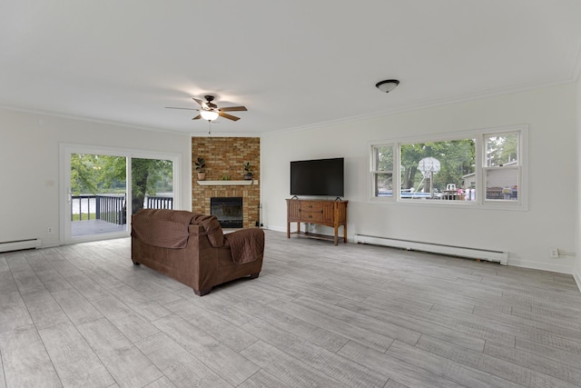 550 N Center St, South Elgin, IL 60177 - living area with a baseboard radiator, ceiling fan, crown molding, light wood-type flooring, and a fireplace