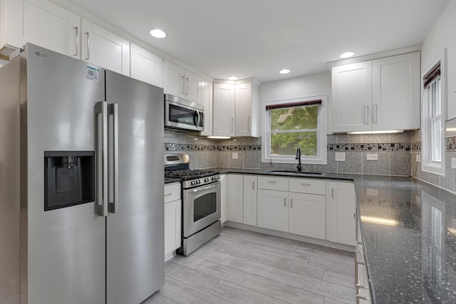 550 N Center St, South Elgin, IL 60177 - kitchen with appliances with stainless steel finishes, white cabinets, dark stone countertops, and recessed lighting