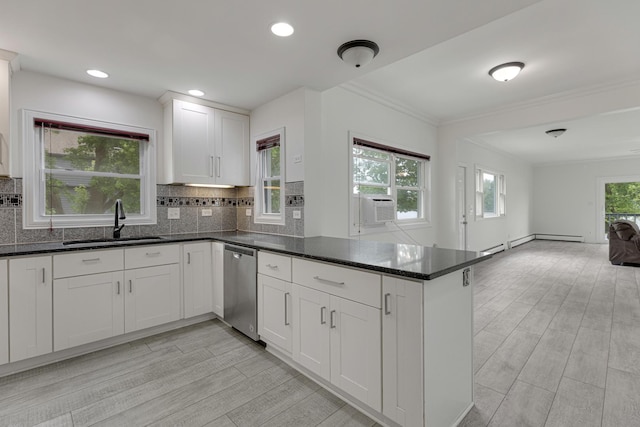550 N Center St, South Elgin, IL 60177 - kitchen featuring dishwasher, a peninsula, decorative backsplash, ornamental molding, and open floor plan