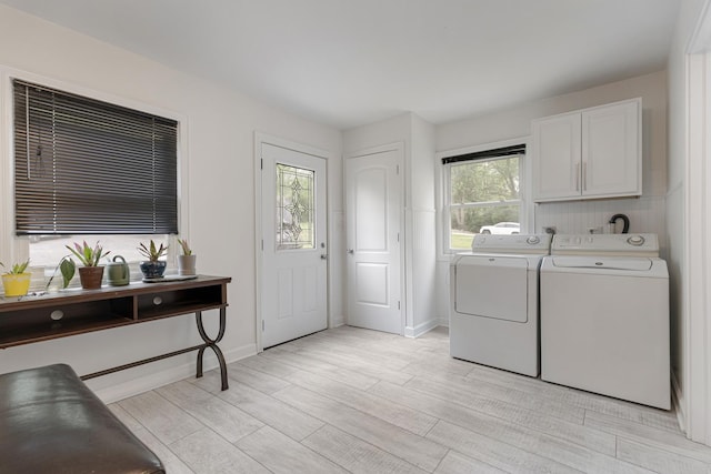 550 N Center St, South Elgin, IL 60177 - laundry room with washer and clothes dryer, light wood-type flooring, and cabinet space